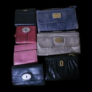 Fossil Wallet Collection in Black, Pink, Red, Gray, and Blue